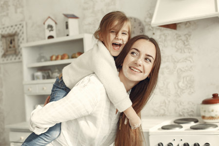People spend time at home in a kitchen