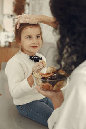 Family eats cookies at homeの写真素材