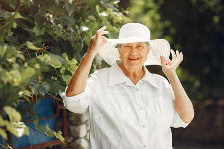 Woman 60 years relax in summer parkの写真素材