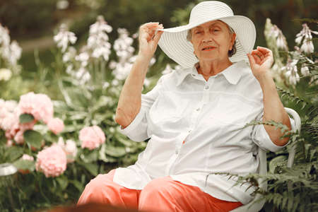 Woman 60 years relax in summer parkの写真素材