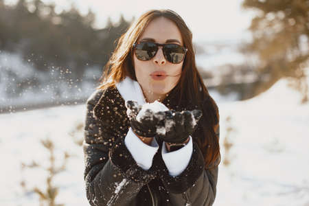 Outdoor photo of fashionable female in winter parkの写真素材