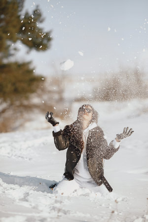 Outdoor photo of fashionable female in winter parkの写真素材