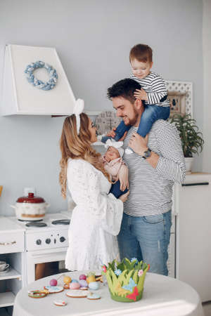 Family with little son in a kitchenの写真素材