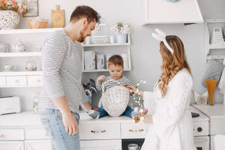 Family with little son in a kitchenの写真素材