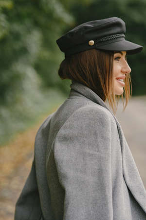 Elegant woman in a autumn parkの写真素材