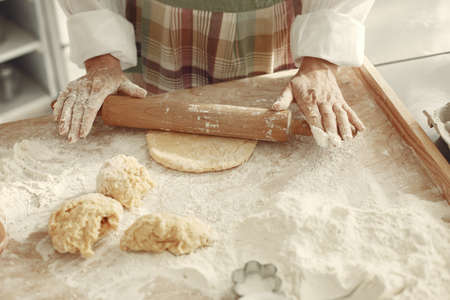 Family cook the dough for cookiesの写真素材