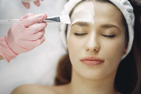 Woman in cosmetology studio on a proceduresの写真素材