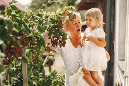 Grandmother and granddaughter enjoyed in the garden