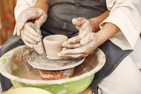 Young couple at artwork in pottery