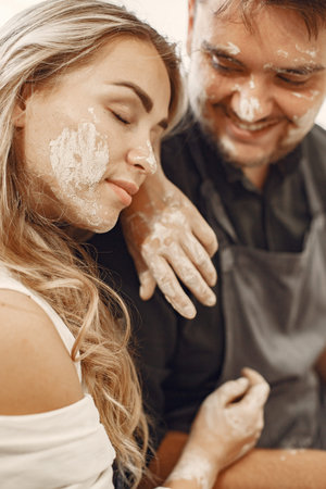 Young couple at artwork in pottery