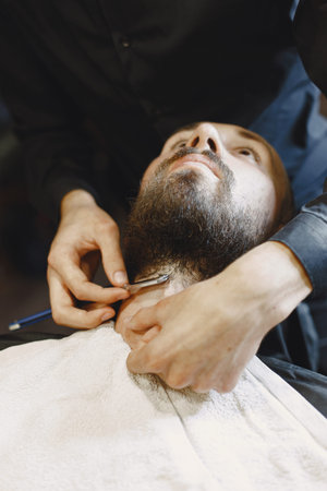 Stylish man sitting in a barbershop