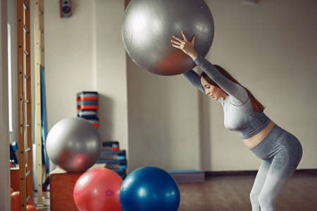 Pregnant woman training in a gymの写真素材