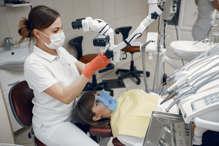 The dentist conducts an examination
