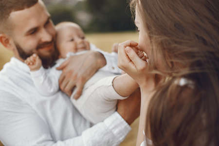 Family spend time in a summer fieldの写真素材