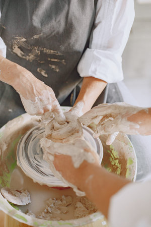 Adult senior couple at artwork in pottery