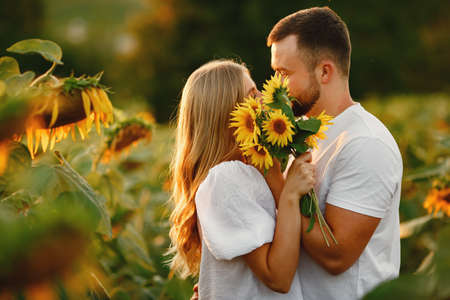 People spend time in a sunflowers fieldの写真素材