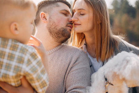 Cute family playing in a spring park