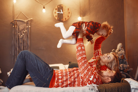 Family with little daughter at homeの写真素材