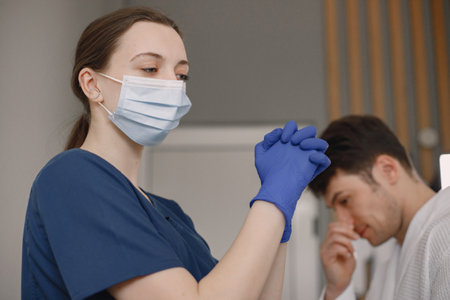 Man in cosmetologist cabinet is going to recieve a skincare procedureの写真素材