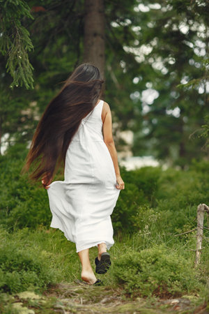 Indian girl in a summer forestの写真素材