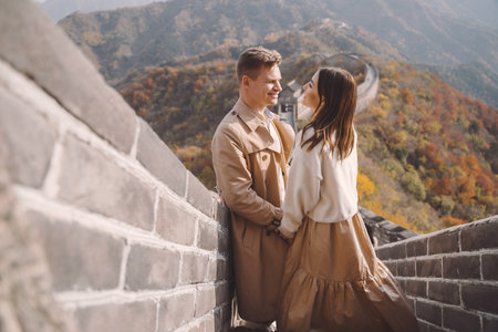 beautiful young couple showing affection on the Great Wall of Chinaの写真素材