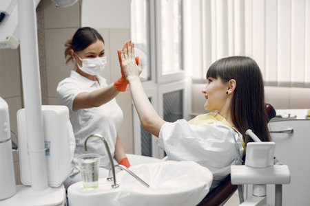 Young woman at the dentists receptionの写真素材