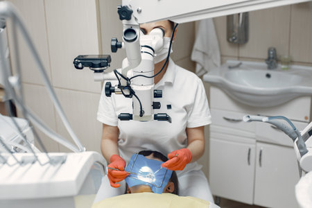 The dentist conducts an examinationの写真素材
