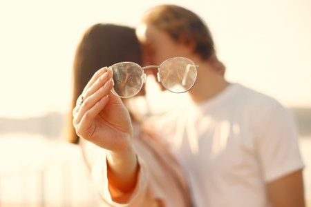 Beautiful couple spend time on a summer parkの写真素材