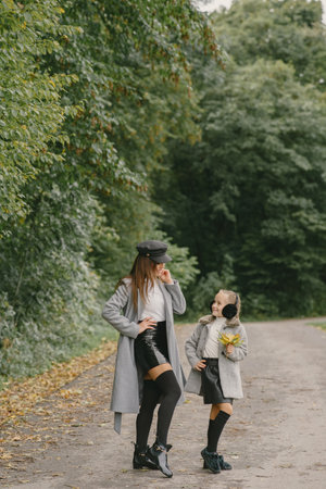 Cute and stylish family in a autumn parkの写真素材