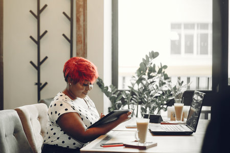 Portrait of a successful business woman using digital tabletの写真素材