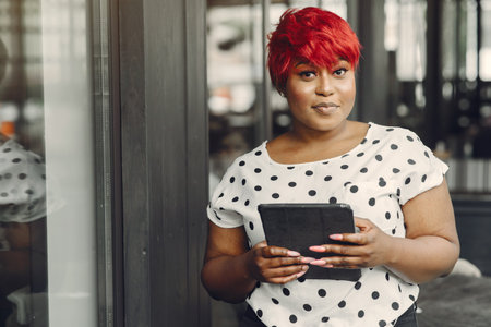 Portrait of a successful business woman using digital tabletの写真素材