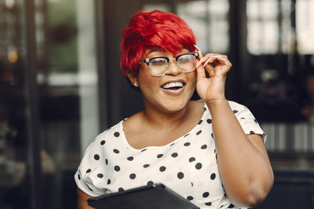 Portrait of a successful business woman using digital tabletの写真素材