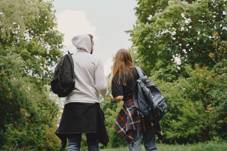 Cute couple have a rest in a summer forestの写真素材