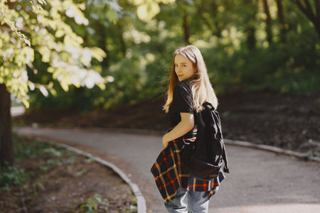 Elegant and stylish girl in a summer forestの写真素材