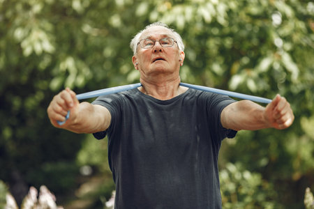 Portrait of happy older man in a parkの写真素材