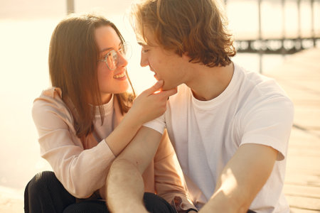 Beautiful couple spend time on a summer parkの写真素材
