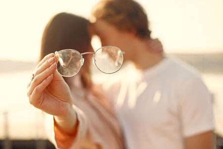 Beautiful couple spend time on a summer parkの写真素材