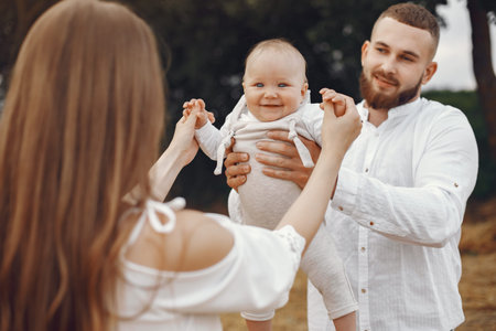 Family spend time in a summer field