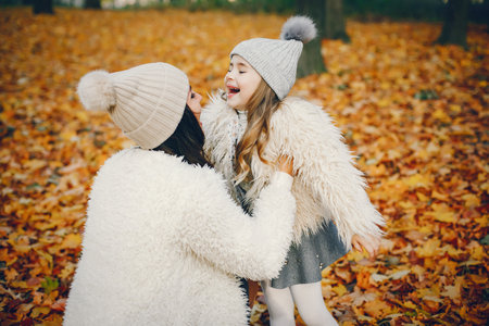 Cute and stylish family in a autumn parkの写真素材