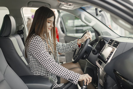 Portrait of caucasian young female driver in a carの写真素材