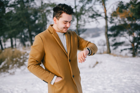 hansome man walking through the parkの写真素材