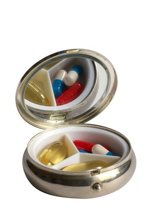 Pocket tablet box with tablet and capsules isolated over white