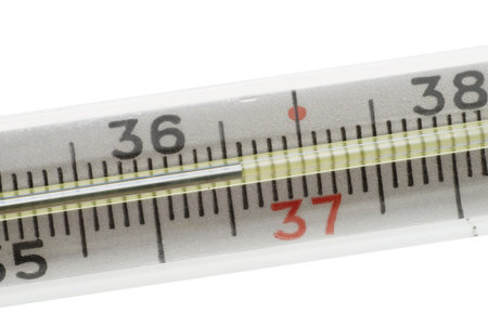 Macro of medical centigrade thermometer isolated on white background. 36.6 C on scale