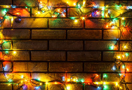 Wreath and garlands of colored light bulbs.Christmas backgroundの写真素材