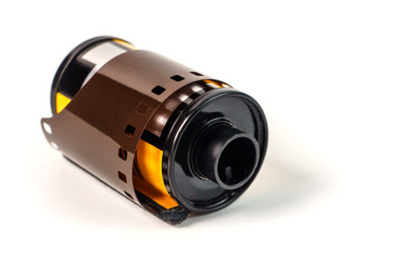 Photo film in cartridge isolated on white. Photographic film in the cassette isolated on white backgroundの写真素材