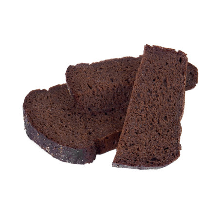 Slice of black rye bread isolated on a white background.の写真素材