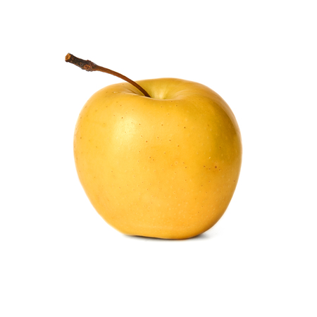 Ripe yellow apple isolated on white background.の写真素材