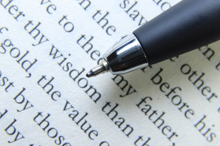 Pen on book