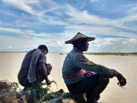 fisherman on river bank stock photoのeditorial素材