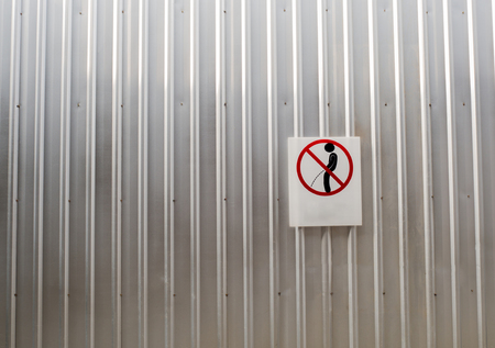 Signs of taboos pee on the wallの写真素材